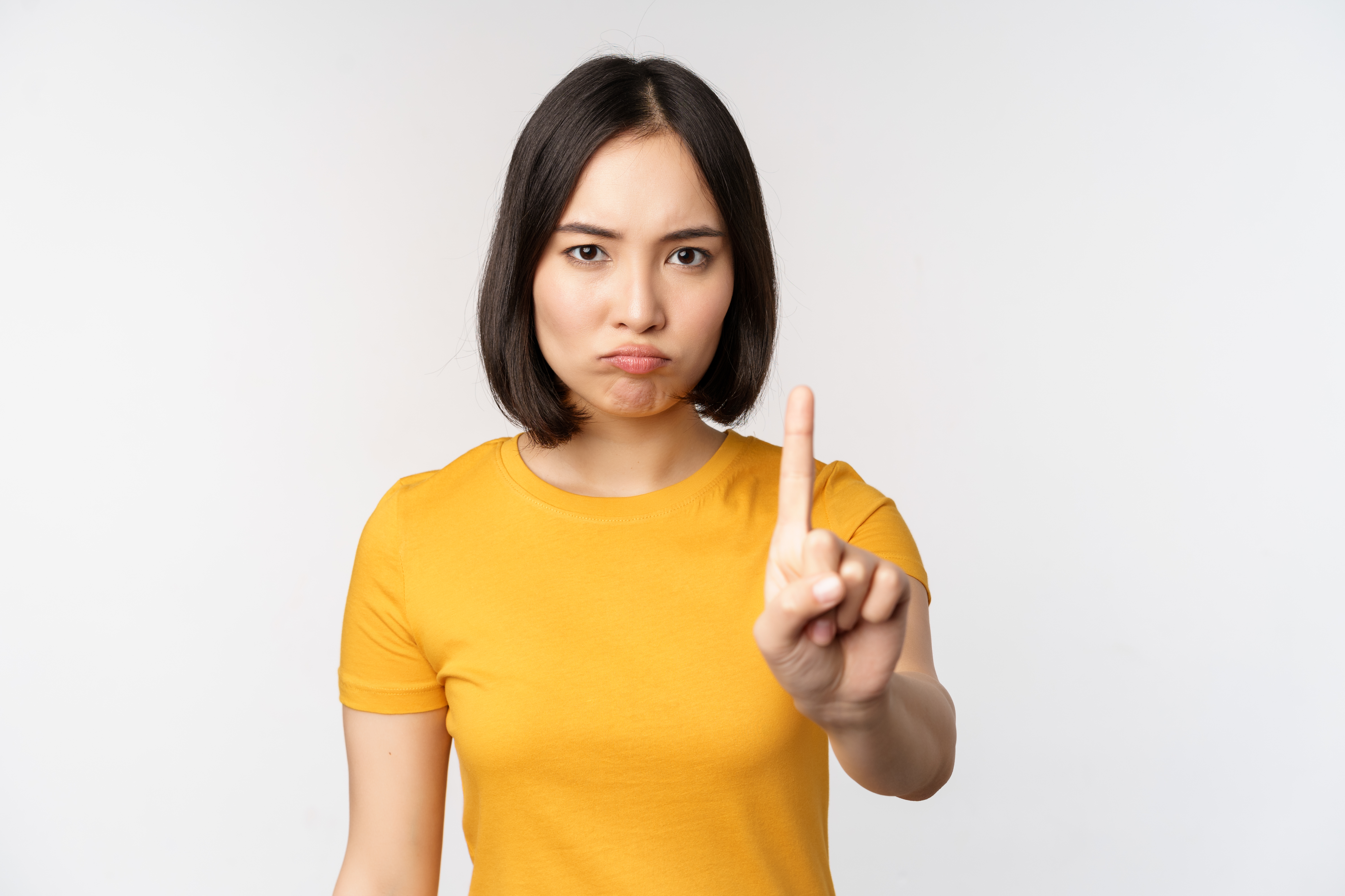 /sites/default/files/guides/portrait-asian-woman-looking-serious-angry-showing-stop-prohibit-gesture-taboo-sign-forbidding-smth-standing-yellow-tshirt-white-background.jpg